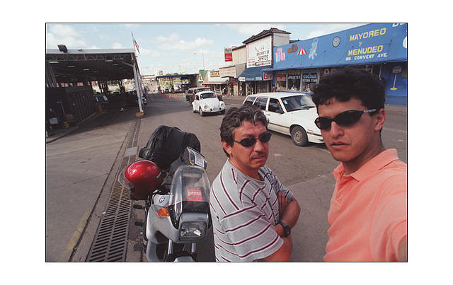 Me and my famous cousin Hector at the border between United States and Mexico. Look at the signs for proof. Again, my trusty K75S.
