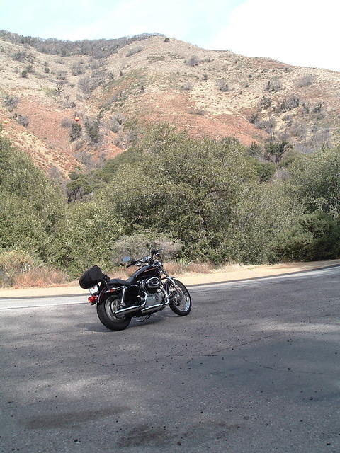This picture along with the one that preceeds it, and a few that follow, was taken on a spectacular road that brought to mind the "canyon carving" so often mentioned in the popular motorcycle mags.