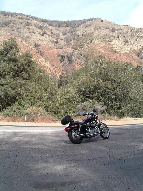 As much as I enjoyed the ride, the ground clearance on the Sportster was lacking, and the forward pegs didn't lend themselves to spirited cornering.