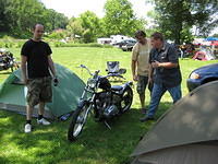 The new owner of Lori's "Bobber" on the left, with his Dad standing behind the bike