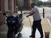 Franz washes his bike. If I didn't have this picture, no one would believe it.