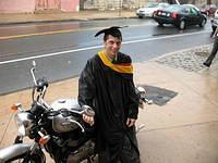 Graduation, April 2007. Stephanie and I rode this Bonnie from my graduation in a downpour dressed as seen here. That goofy cardboard hat doesn't like to get wet, and neither does Stephanie. She married me anyway.