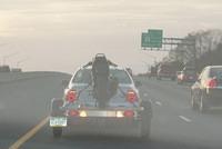 White vehicle with motorcycle trailer, traveling on I-95 at a high rate of speed...